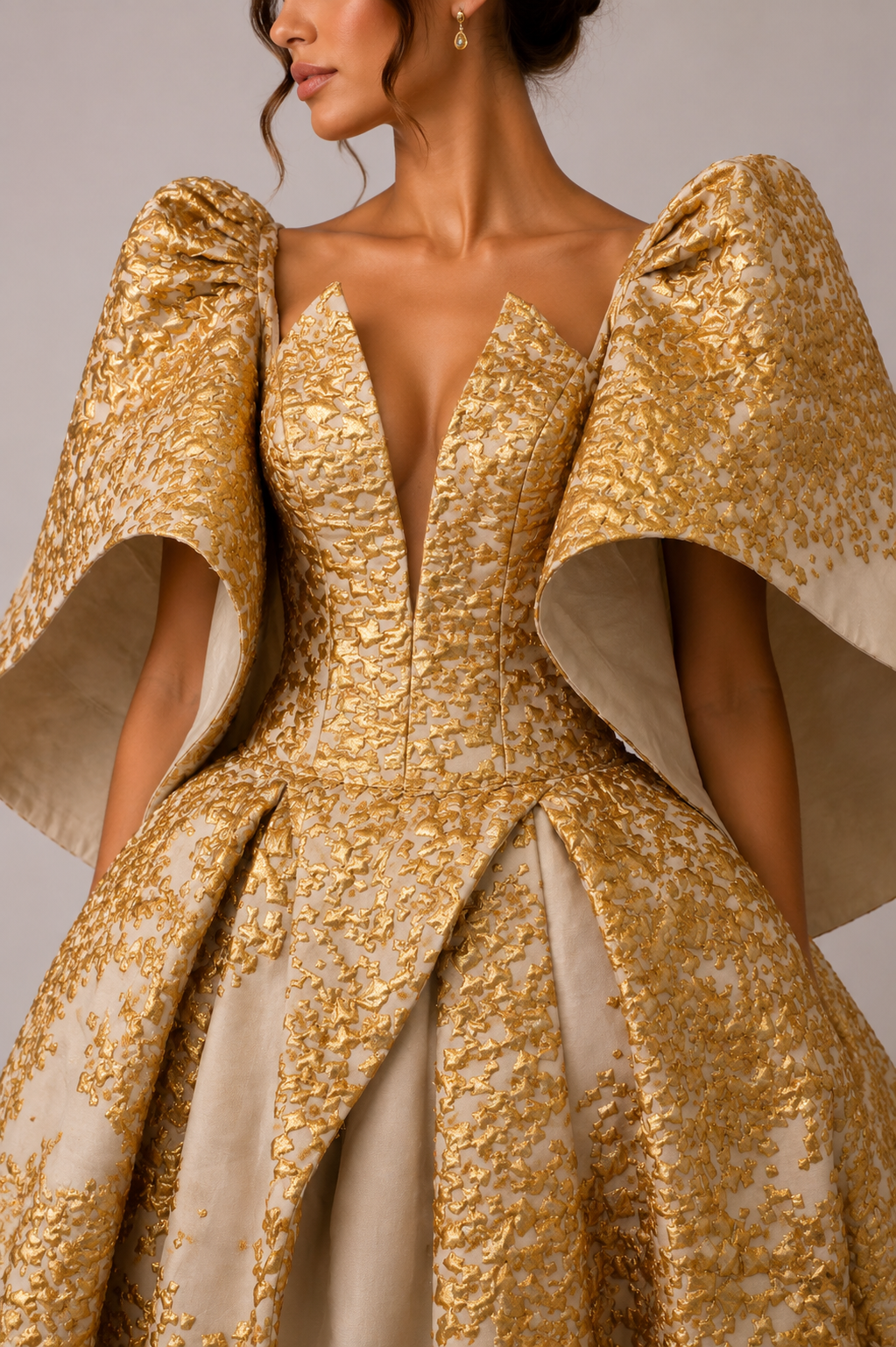 IVORY AND GOLD SCULPTURAL BALL GOWN